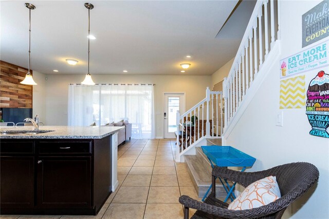 1979 Majorca Dr, Kissimmee, FL 34747 - kitchen with a sink, light tile patterned floors, open floor plan, hanging light fixtures, and recessed lighting