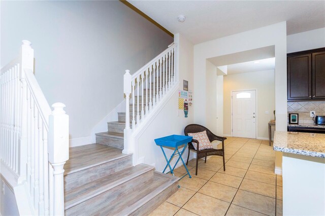 1979 Majorca Dr, Kissimmee, FL 34747 - stairs with tile patterned flooring and baseboards