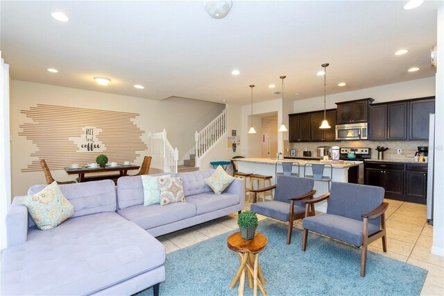 1979 Majorca Dr, Kissimmee, FL 34747 - living area with light tile patterned flooring, stairway, and recessed lighting