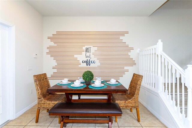 1979 Majorca Dr, Kissimmee, FL 34747 - dining room with light tile patterned floors, stairway, and baseboards