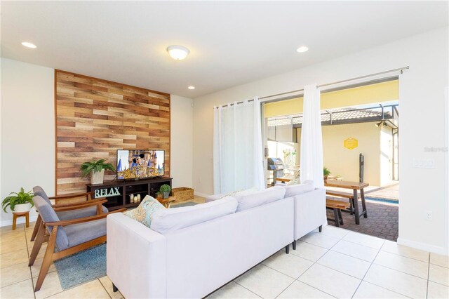 1979 Majorca Dr, Kissimmee, FL 34747 - living room with recessed lighting, light tile patterned floors, and baseboards