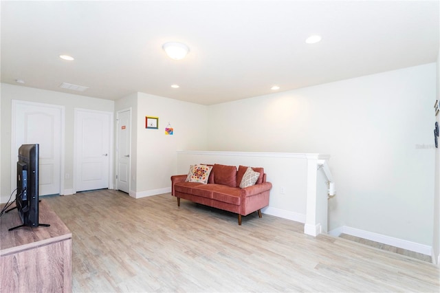 1979 Majorca Dr, Kissimmee, FL 34747 - living area with light wood finished floors, an upstairs landing, baseboards, and recessed lighting