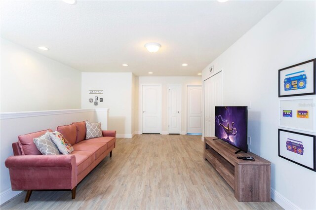 1979 Majorca Dr, Kissimmee, FL 34747 - living area featuring light wood finished floors, baseboards, and recessed lighting