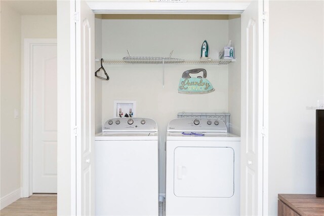 1979 Majorca Dr, Kissimmee, FL 34747 - laundry room with washer and clothes dryer and light wood-style floors