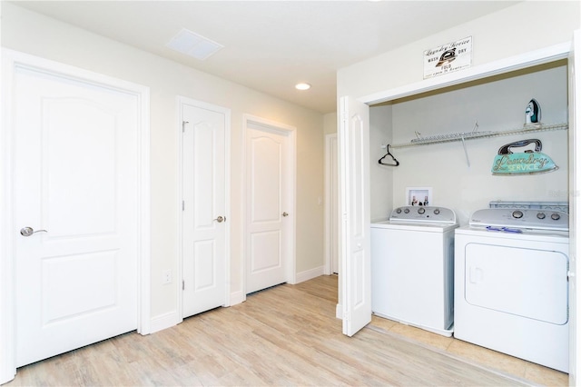 1979 Majorca Dr, Kissimmee, FL 34747 - laundry area featuring washer and dryer, light wood finished floors, recessed lighting, and baseboards
