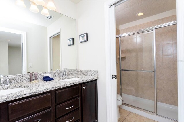 1979 Majorca Dr, Kissimmee, FL 34747 - full bathroom with a stall shower, toilet, tile patterned flooring, double vanity, and recessed lighting