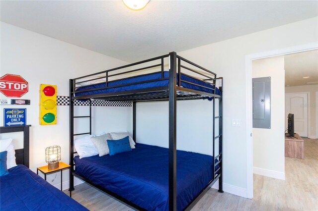 1979 Majorca Dr, Kissimmee, FL 34747 - bedroom with electric panel, wood finished floors, and baseboards