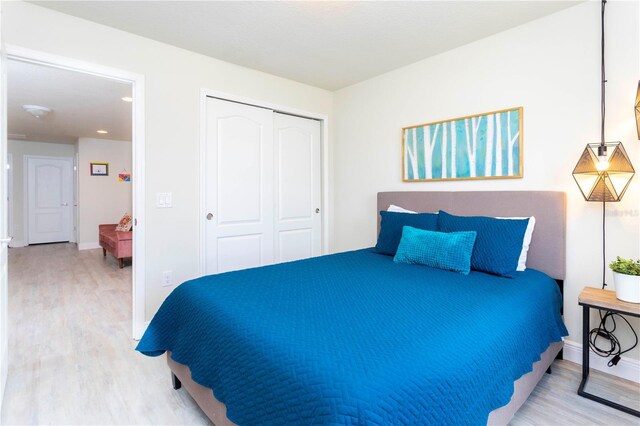 1979 Majorca Dr, Kissimmee, FL 34747 - bedroom with wood finished floors, a closet, baseboards, and recessed lighting