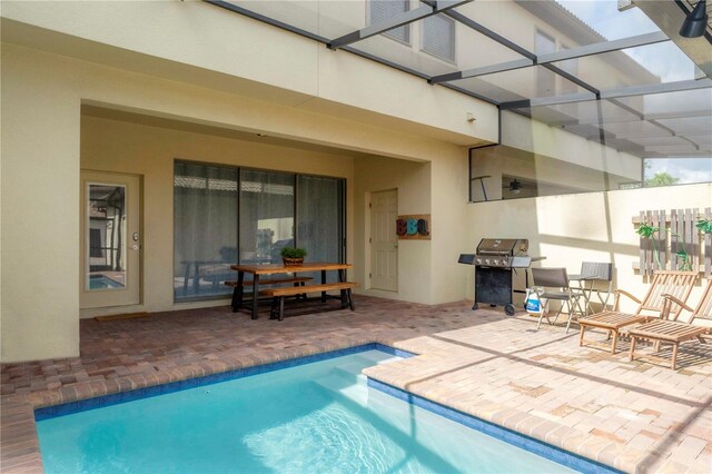 1979 Majorca Dr, Kissimmee, FL 34747 - outdoor pool with a patio, a lanai, and grilling area
