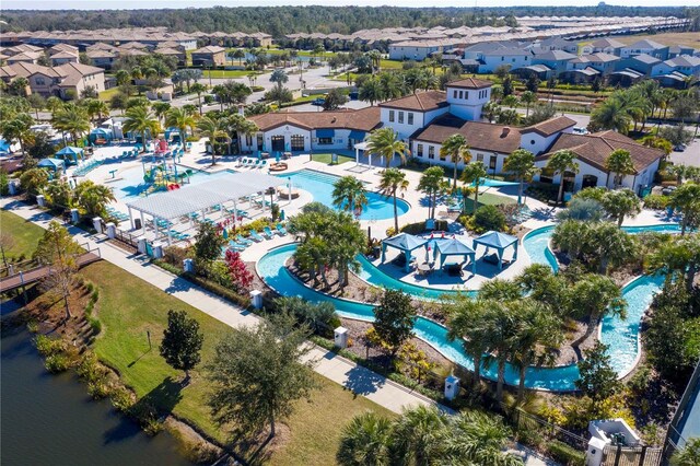 1979 Majorca Dr, Kissimmee, FL 34747 - aerial view of residential area with a pool and a nearby body of water