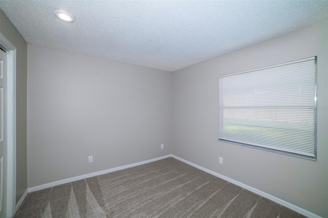 838 Haulover Dr, Altamonte Springs, FL 32714 - spare room featuring dark colored carpet, a textured ceiling, baseboards, and recessed lighting