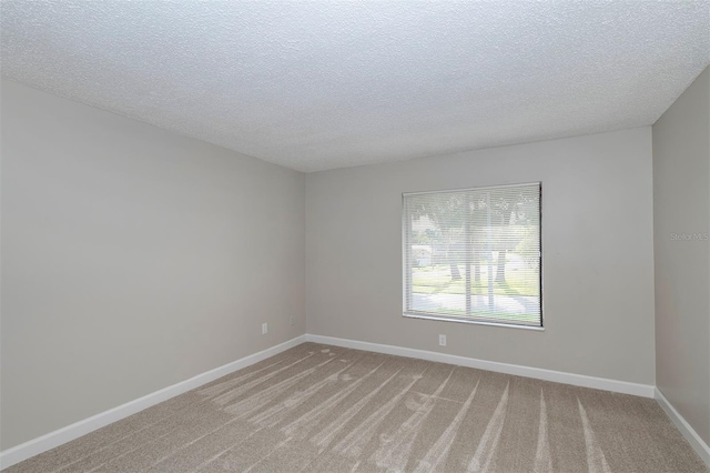 838 Haulover Dr, Altamonte Springs, FL 32714 - unfurnished room with light colored carpet, baseboards, and a textured ceiling