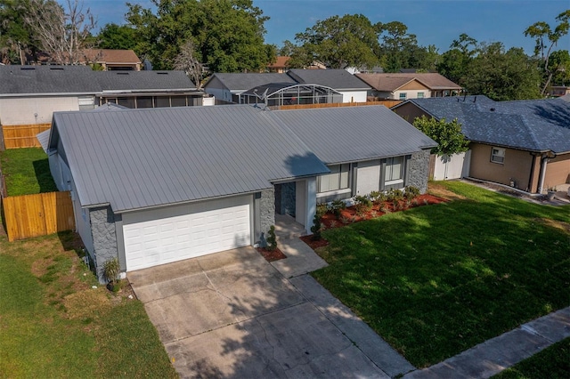 838 Haulover Dr, Altamonte Springs, FL 32714 - view of front facade featuring stone siding, metal roof, concrete driveway, and a residential view