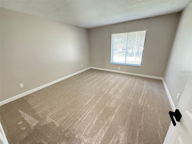 838 Haulover Dr, Altamonte Springs, FL 32714 - unfurnished room with a textured ceiling, carpet flooring, and baseboards