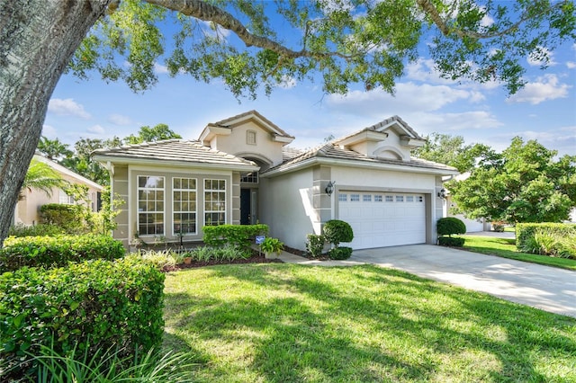 404 Sotheby Way, Debary, FL 32713 - view of front of property with an attached garage, a front yard, stucco siding, concrete driveway, and a tiled roof