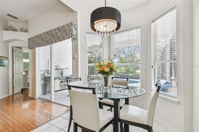 404 Sotheby Way, Debary, FL 32713 - dining area with plenty of natural light, a chandelier, and baseboards