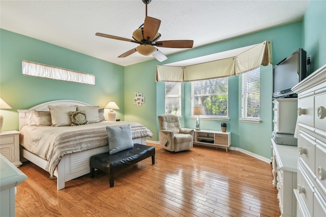 404 Sotheby Way, Debary, FL 32713 - bedroom with hardwood / wood-style flooring, a ceiling fan, and baseboards