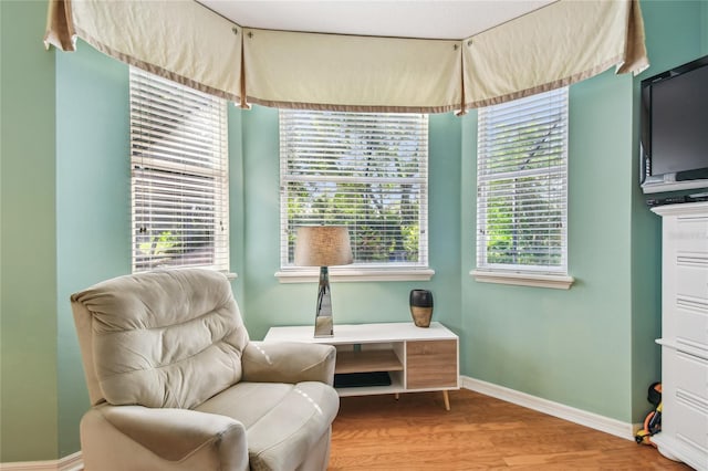 404 Sotheby Way, Debary, FL 32713 - sitting room featuring wood finished floors and baseboards