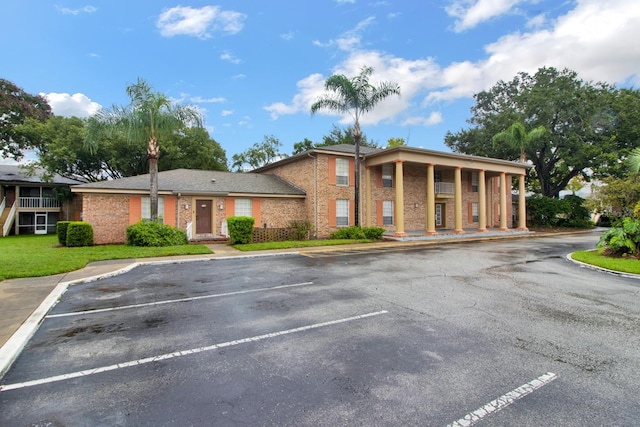 416 Banyon Tree Cir Unit 108, Maitland, FL 32751 - neoclassical / greek revival house featuring uncovered parking and brick siding