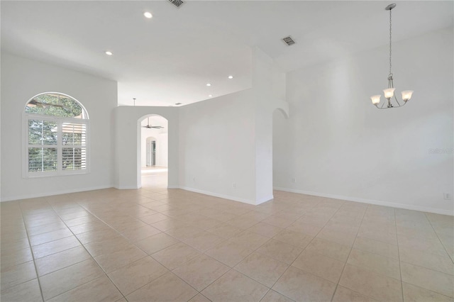 10955 Lemay Dr, Clermont, FL 34711 - spare room featuring arched walkways, a chandelier, light tile patterned floors, and recessed lighting