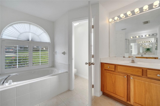10955 Lemay Dr, Clermont, FL 34711 - bathroom featuring vanity, a garden tub, and tile patterned floors