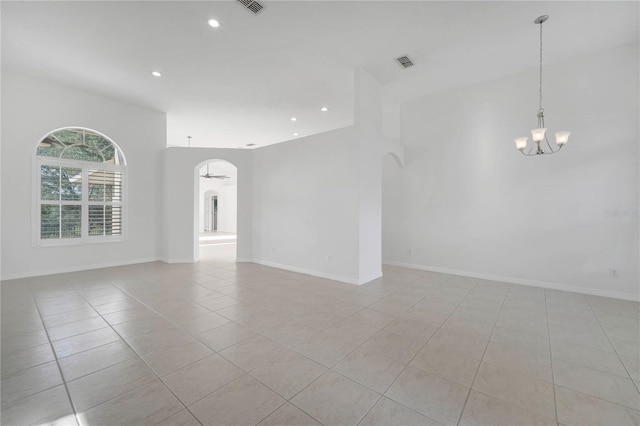 10955 Lemay Dr, Clermont, FL 34711 - empty room featuring arched walkways, a chandelier, light tile patterned floors, and recessed lighting