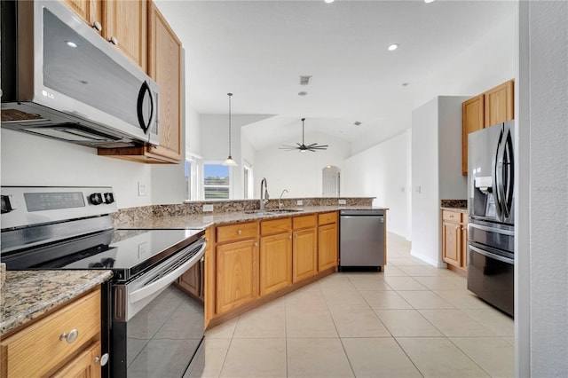 10955 Lemay Dr, Clermont, FL 34711 - kitchen with stainless steel appliances, a peninsula, light stone counters, ceiling fan, and lofted ceiling