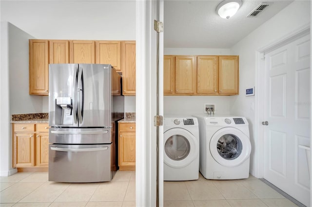 10955 Lemay Dr, Clermont, FL 34711 - laundry area featuring washing machine and clothes dryer and light tile patterned floors