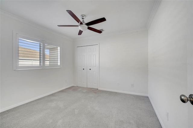 10955 Lemay Dr, Clermont, FL 34711 - unfurnished bedroom featuring crown molding, light colored carpet, a closet, and a ceiling fan