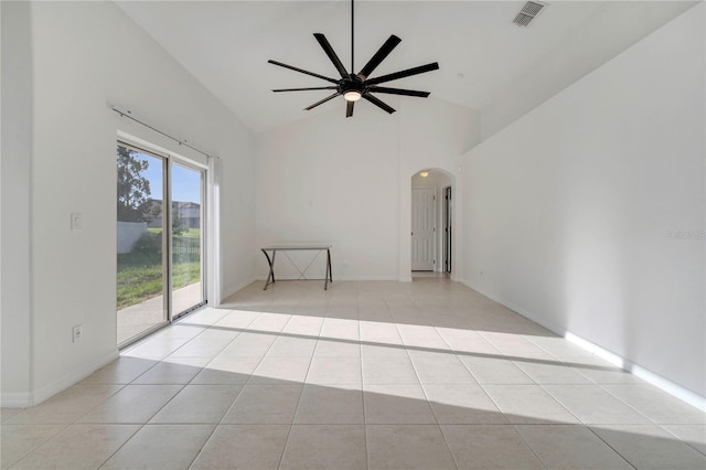 10955 Lemay Dr, Clermont, FL 34711 - empty room with arched walkways, ceiling fan, light tile patterned floors, and high vaulted ceiling
