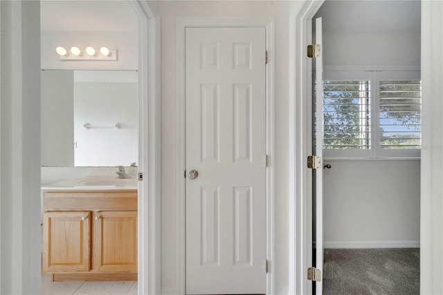 10955 Lemay Dr, Clermont, FL 34711 - corridor featuring a sink and baseboards