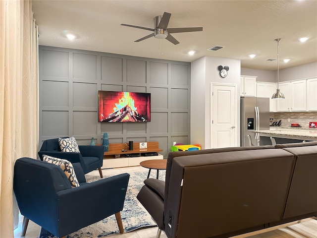 271 Jetty Way, Davenport, FL 33897 - living room featuring a decorative wall, ceiling fan, and recessed lighting