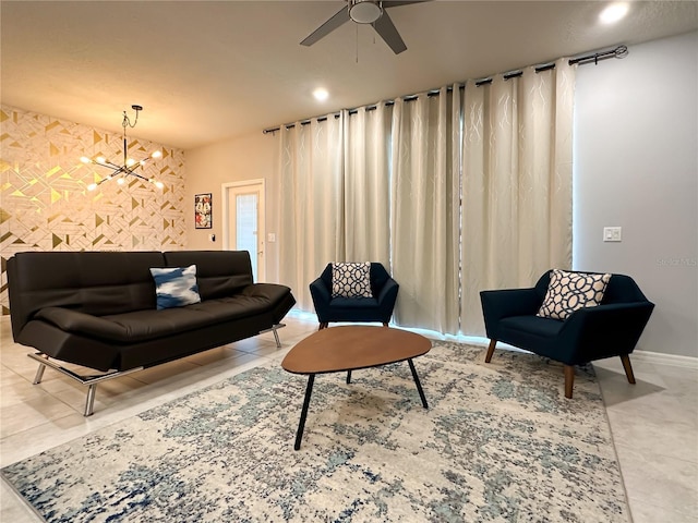 271 Jetty Way, Davenport, FL 33897 - living room with ceiling fan, a chandelier, baseboards, recessed lighting, and an accent wall