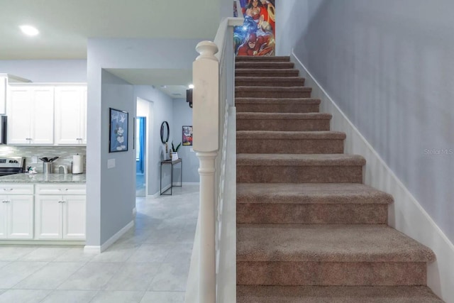 271 Jetty Way, Davenport, FL 33897 - stairway featuring tile patterned floors and baseboards