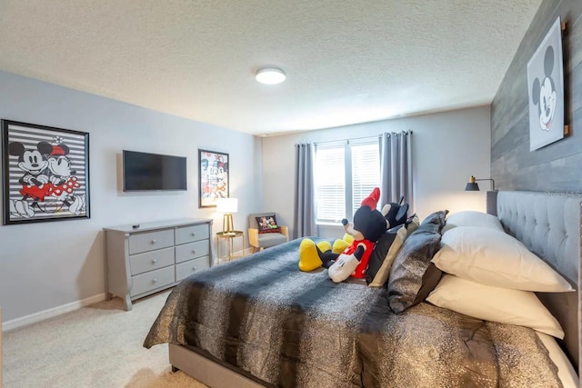 271 Jetty Way, Davenport, FL 33897 - bedroom featuring light carpet, a textured ceiling, and baseboards