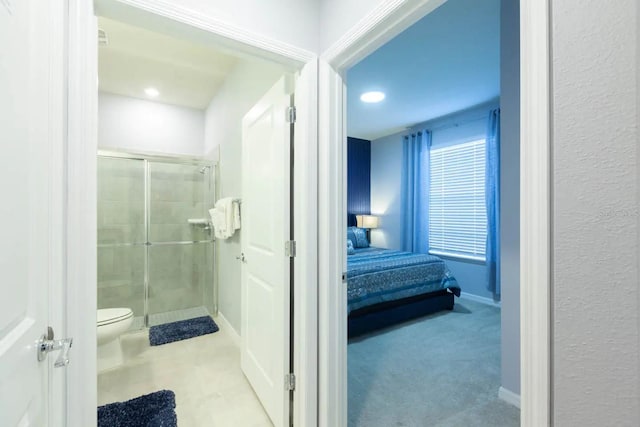271 Jetty Way, Davenport, FL 33897 - ensuite bathroom with a shower stall, toilet, baseboards, and recessed lighting