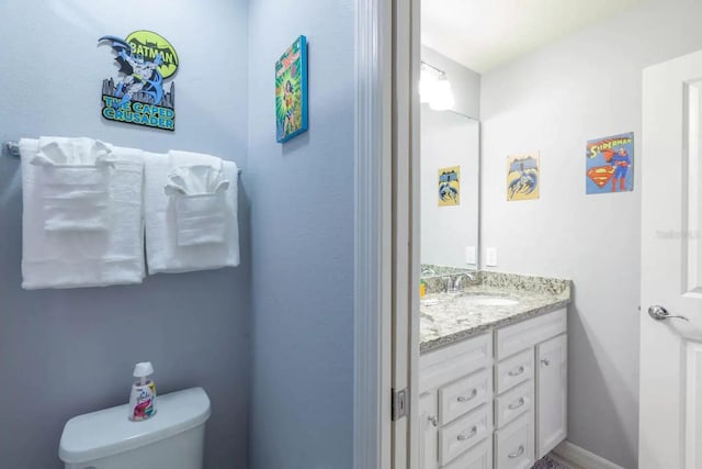 271 Jetty Way, Davenport, FL 33897 - bathroom featuring vanity, toilet, and baseboards