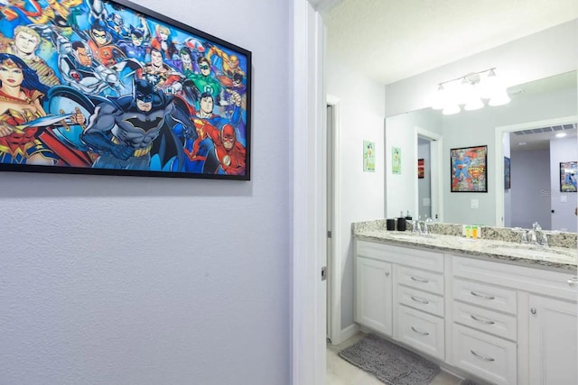 271 Jetty Way, Davenport, FL 33897 - bathroom featuring double vanity and baseboards