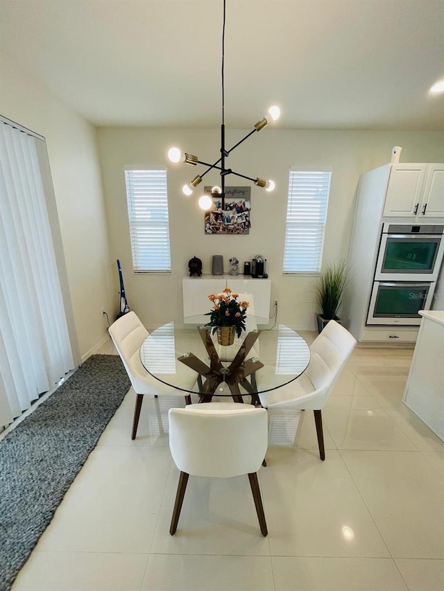 14753 Snowy Egret St, Winter Garden, FL 34787 - dining area with a chandelier and light tile patterned floors