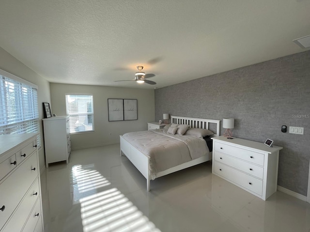 14753 Snowy Egret St, Winter Garden, FL 34787 - bedroom featuring baseboards, a textured ceiling, and ceiling fan
