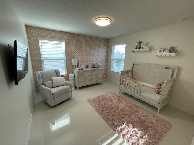 14753 Snowy Egret St, Winter Garden, FL 34787 - bedroom featuring wallpapered walls, baseboards, and a textured ceiling