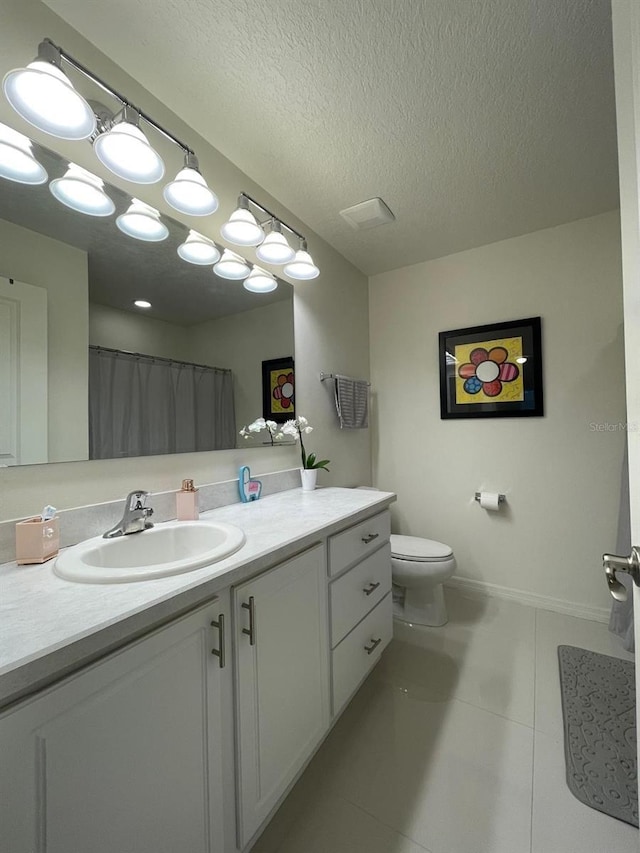 14753 Snowy Egret St, Winter Garden, FL 34787 - full bathroom with vanity, tile patterned flooring, toilet, and a textured ceiling