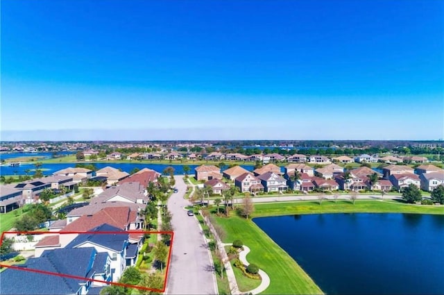 14753 Snowy Egret St, Winter Garden, FL 34787 - aerial view of residential area with property boundaries highlighted and a large body of water
