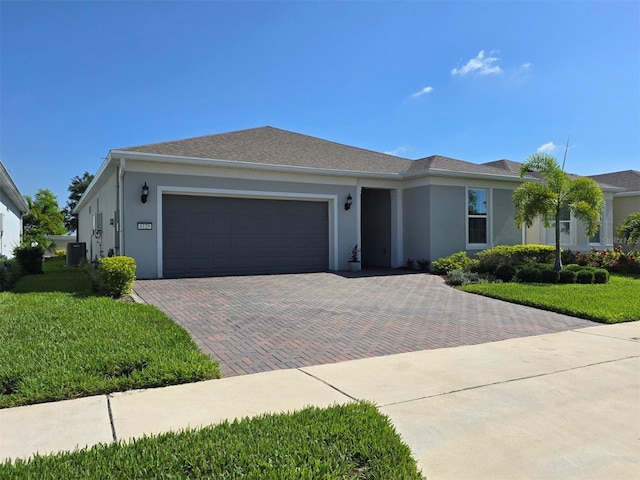 6129 Citrus Grove Ct, Saint Cloud, FL 34771 - ranch-style house featuring decorative driveway, an attached garage, stucco siding, and a front lawn