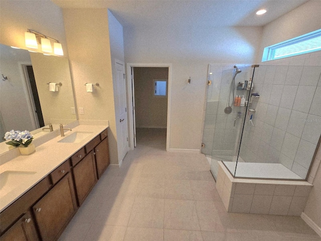 6129 Citrus Grove Ct, Saint Cloud, FL 34771 - bathroom featuring tiled shower, double vanity, tile patterned flooring, baseboards, and recessed lighting