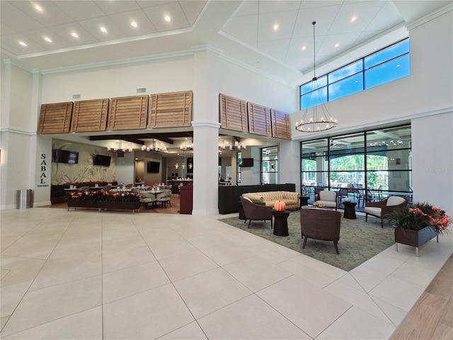 6129 Citrus Grove Ct, Saint Cloud, FL 34771 - building lobby featuring a towering ceiling, ornamental molding, and recessed lighting