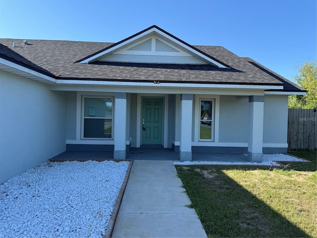 468 Marion Oaks Blvd, Ocala, FL 34473 - view of exterior entry featuring roof with shingles, stucco siding, and covered porch