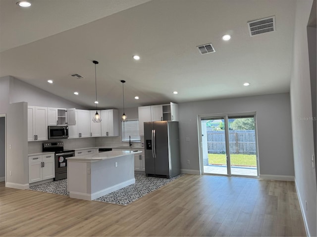 468 Marion Oaks Blvd, Ocala, FL 34473 - kitchen with stainless steel appliances, open shelves, a sink, white cabinetry, and light countertops