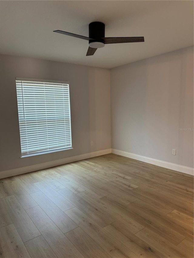 468 Marion Oaks Blvd, Ocala, FL 34473 - spare room with baseboards, wood finished floors, and a ceiling fan