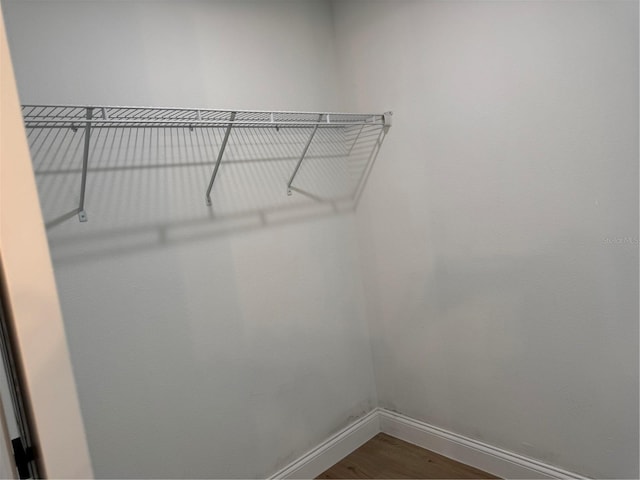 468 Marion Oaks Blvd, Ocala, FL 34473 - walk in closet featuring dark wood-style floors